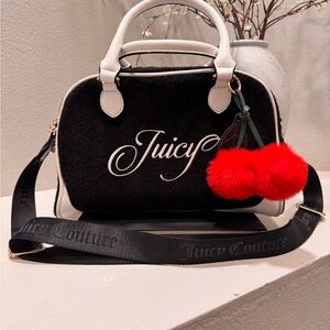 Juicy Couture Raising Star Bowler Bag in the "Liquorice” colorway.